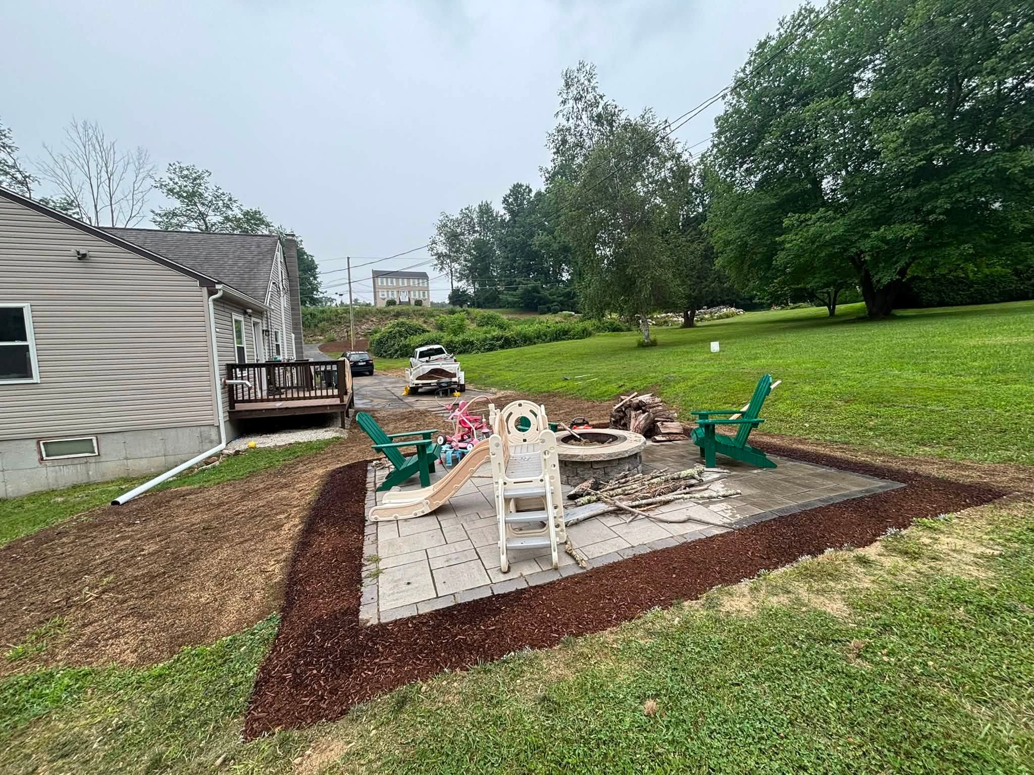 Natural stone walkway installed — clean entry from driveway